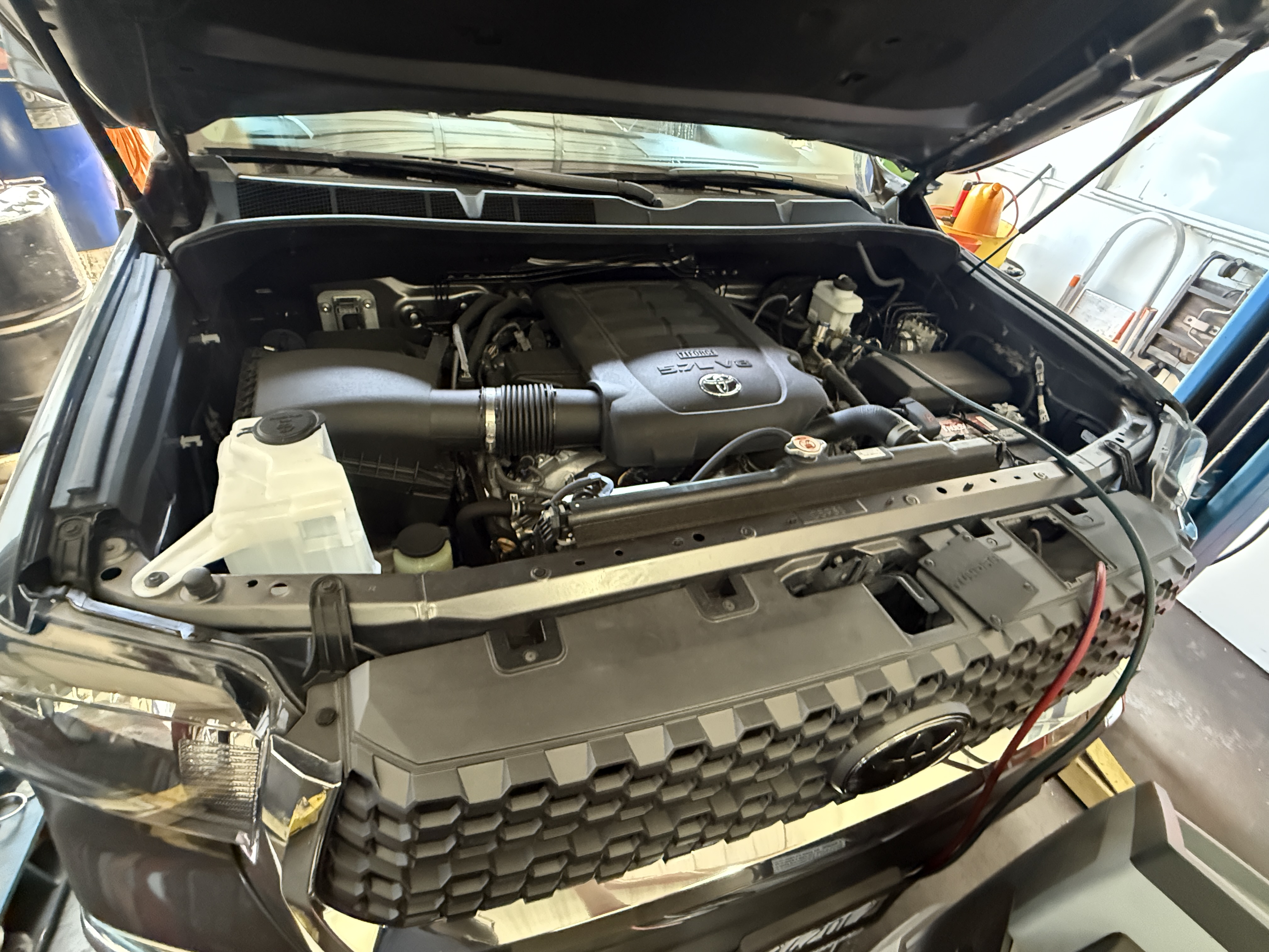 Master mechanic working on car in Corona CA auto repair shop